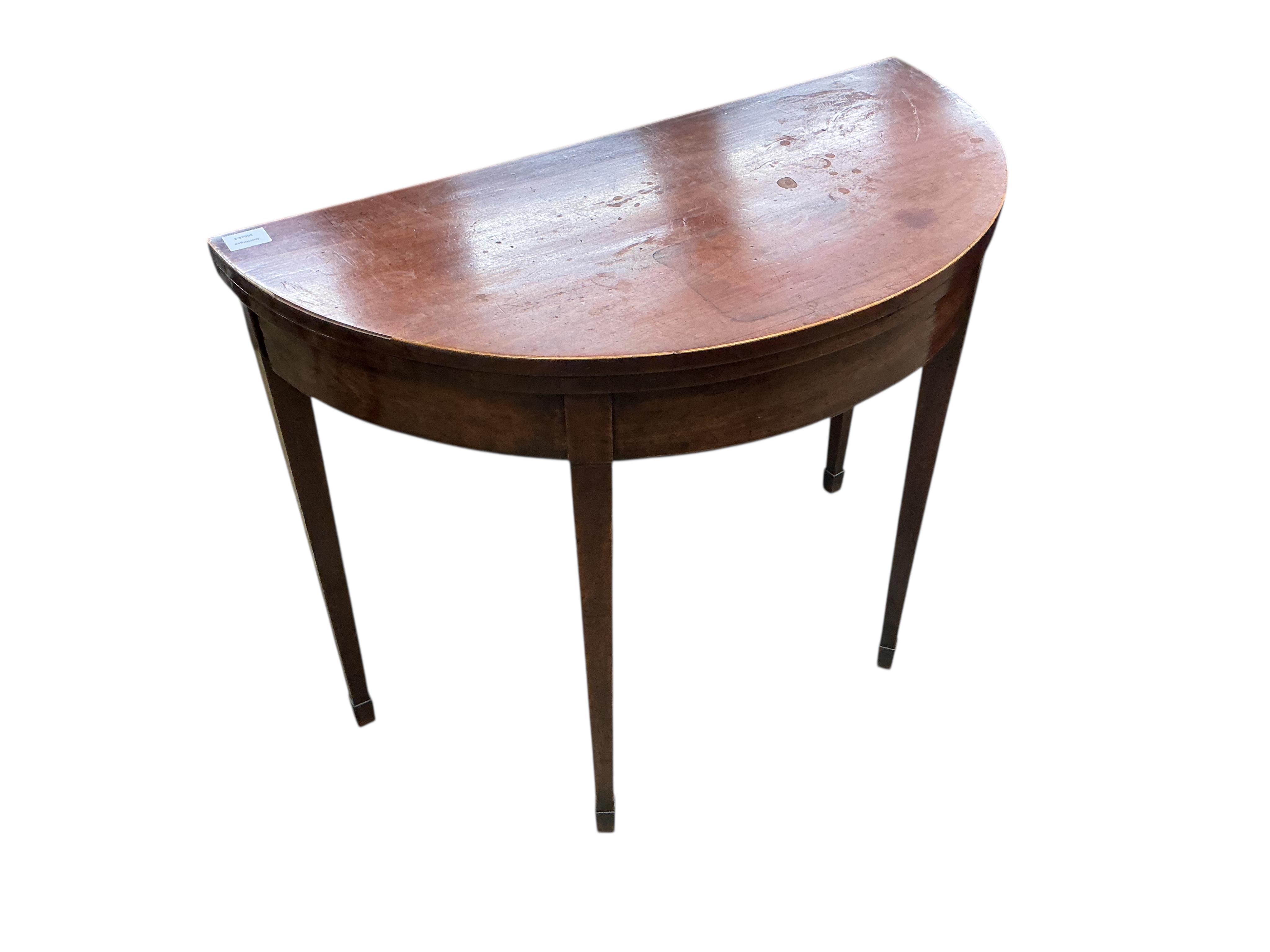 A George III mahogany 'D' shaped folding tea table, width 90cm, depth 45cm, height 73cm